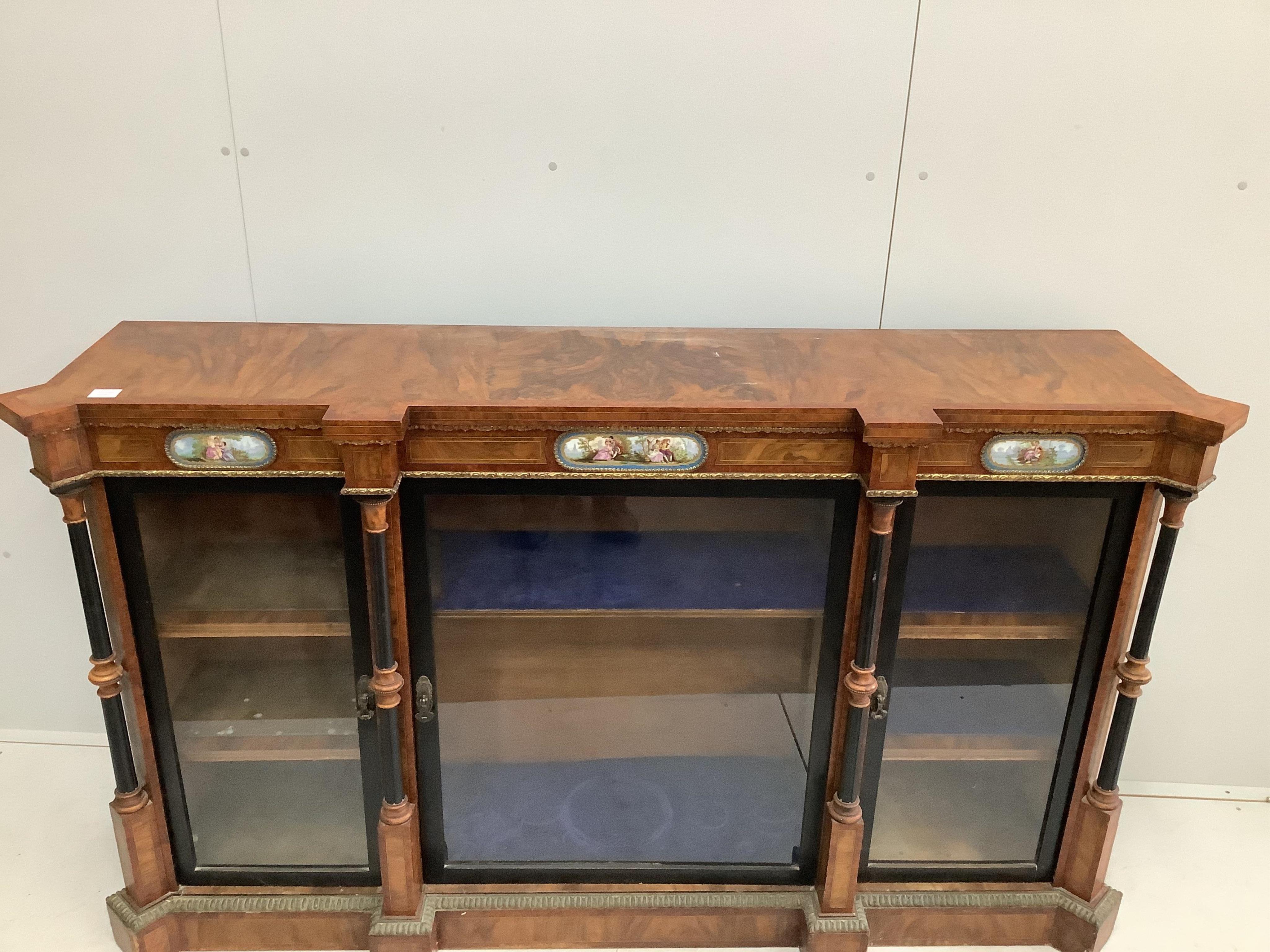 A Victorian amboyna banded figured walnut credenza, width 188cm, depth 44cm, height 109cm. Condition - fair to good